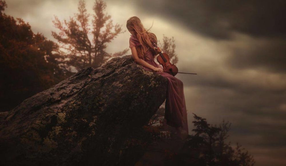 Professional mountain expedition team standing together at base camp with snow-capped peaks in background