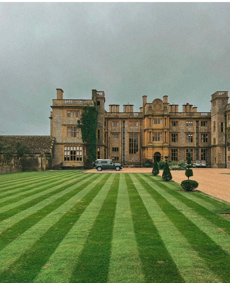 Expedition camp with colorful tents set up beside crystal clear alpine lake reflecting surrounding peaks
