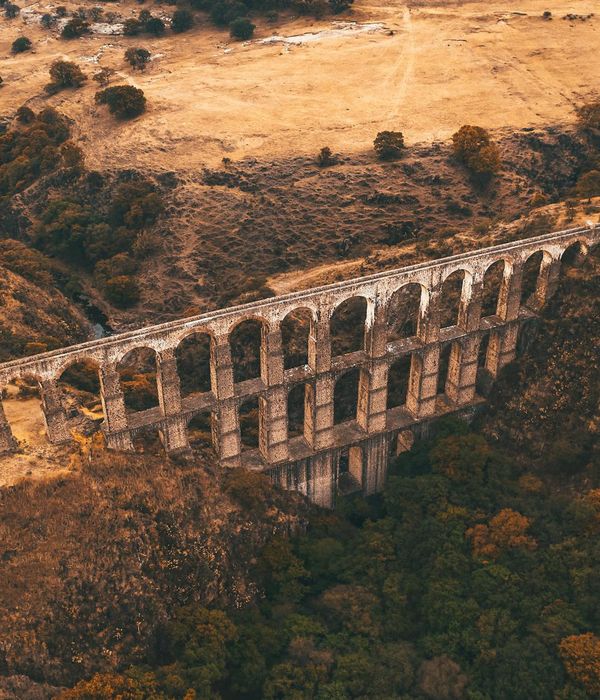 Historic Silk Road trading post with ancient caravanserai architecture in desert setting